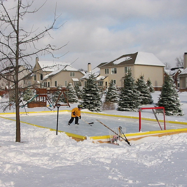 Kid practicing in backyard ice rink