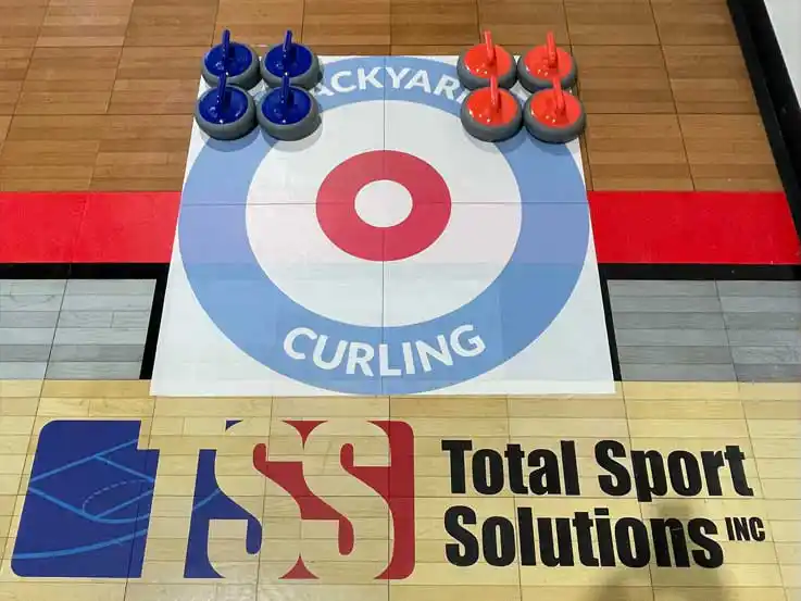 Kid practicing hockey in his backyard