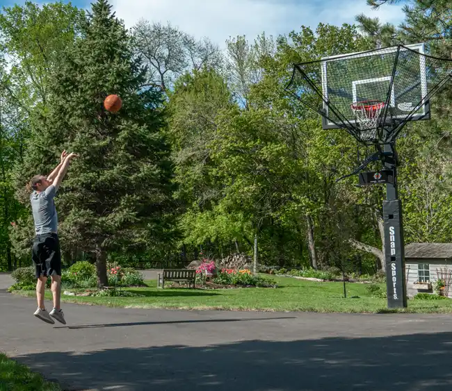 Man smoothing an ice rink surface with a 32 inches NiceIce™ Resurfacer
