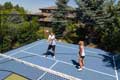 Playing volleyball on a backyard multicourt