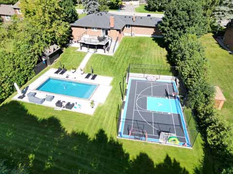 >Half Size, Grey and Blue, Outdoor Basketball Court in King City, ON. Jumping man logo