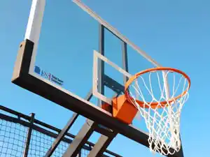 Basketball hoop and net on outdoor multi-sport court at St. John's-Kilmarnock School Breslau Ontario