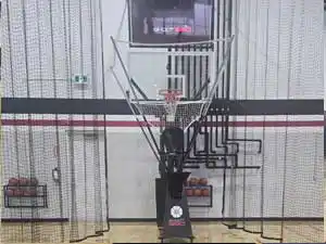 An interactive AI-driven basketball passing and shooting training station set up on premium hardwood flooring.