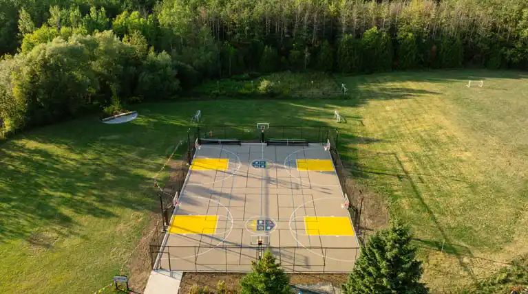 Completed outdoor multigame court at St. John's-Kilmarnock School in Breslau, Ontario installed by Total Sport Solutions