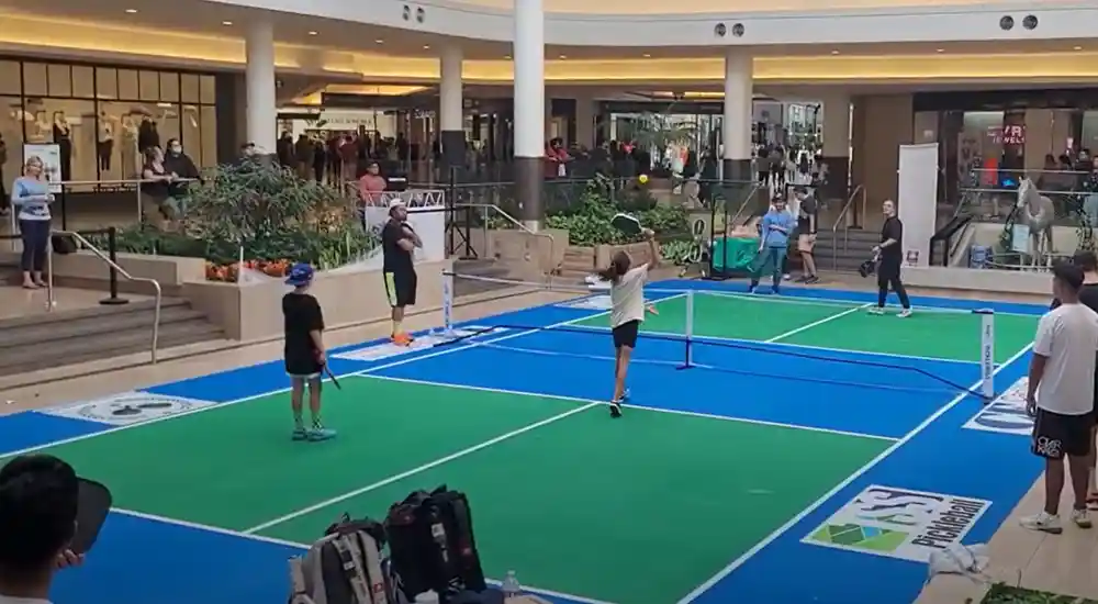 Visitors play on a temporary indoor pickleball court installed by TSS Pickleball at Sherway Gardens Mall in Etobicoke