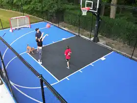 Safe family fun in North York! This 23' by 49'court includes perimeter containment fencing, letting kids play hard without chasing stray balls.