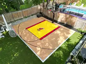 Expert installation of a 25' x 30' themed sport court next to the pool in Toronto. The durable tile surface ensures safe, low-maintenance fun for kids of all ages.