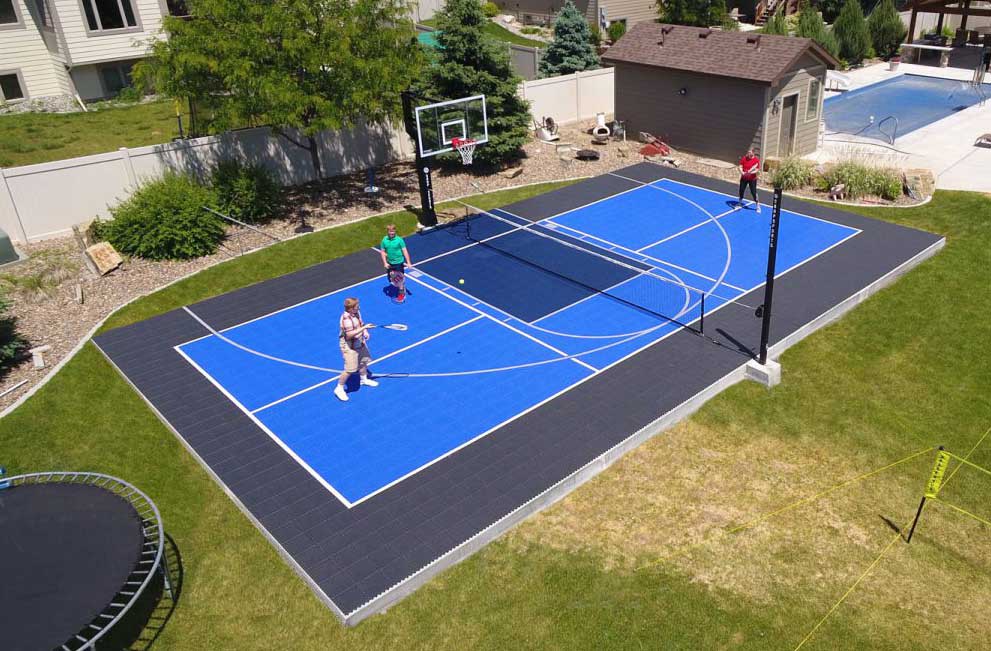 Family playing in backyard court