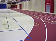 Poured Rubber Floors can make a gym with surrounding track