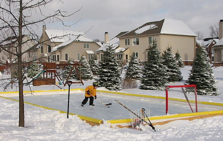 Kid practicing on his backyard ice rink 